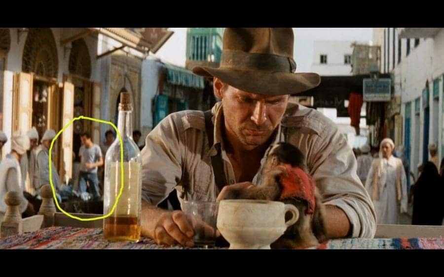 A background artist is spotted wearing jeans in Indiana Jones and the Raiders of the Lost Ark