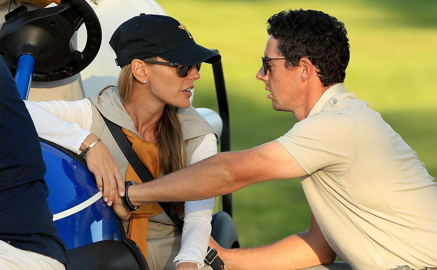 Rory McIlroy of Europe speaks to Erica Stoll during afternoon fourball matches.