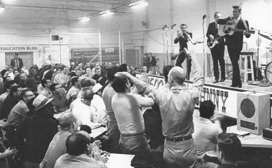 Johnny Cash performs on stage at the prison.